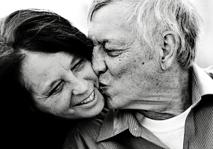 Happy elderly couple kissing